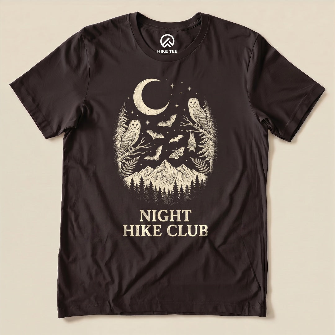 Brown Night Hike Club Shirt with a crescent moon, owls, bats and mountains graphic