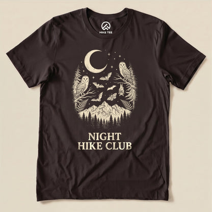 Brown Night Hike Club Shirt with a crescent moon, owls, bats and mountains graphic