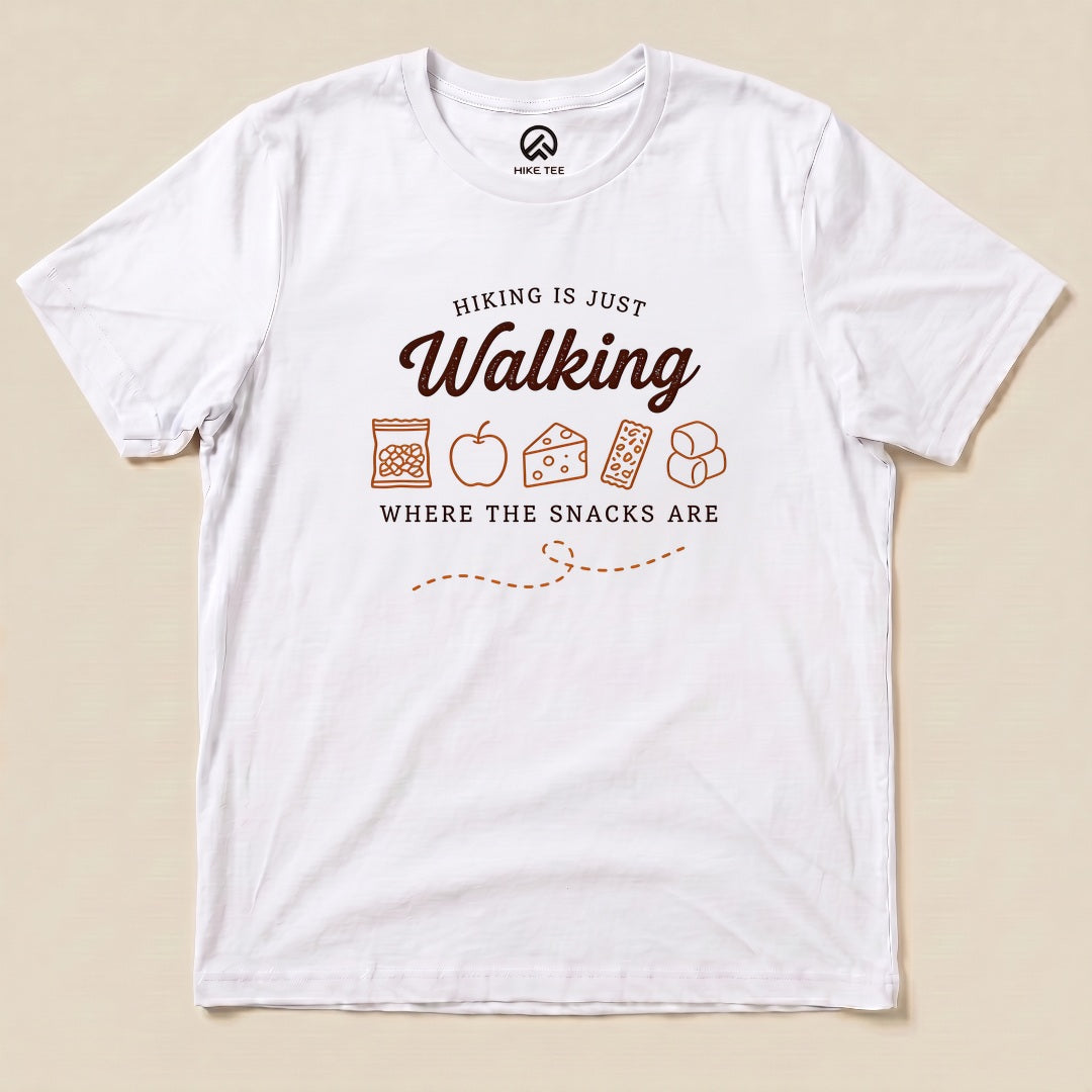 White Hiking Is Just Walking Where the Snacks Are Shirt with a trail snacks graphic