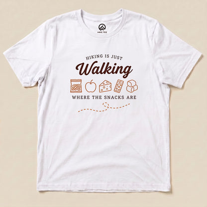 White Hiking Is Just Walking Where the Snacks Are Shirt with a trail snacks graphic