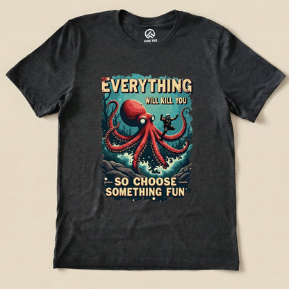 The graphic t-shirt features a vibrant print of an octopus and a hiker, with the slogan "Everything Kills You - So Choose Something Fun.