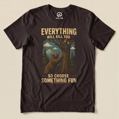 Brown Everything Will Kill You Shirt with a bear chasing a hiker up a tree graphic