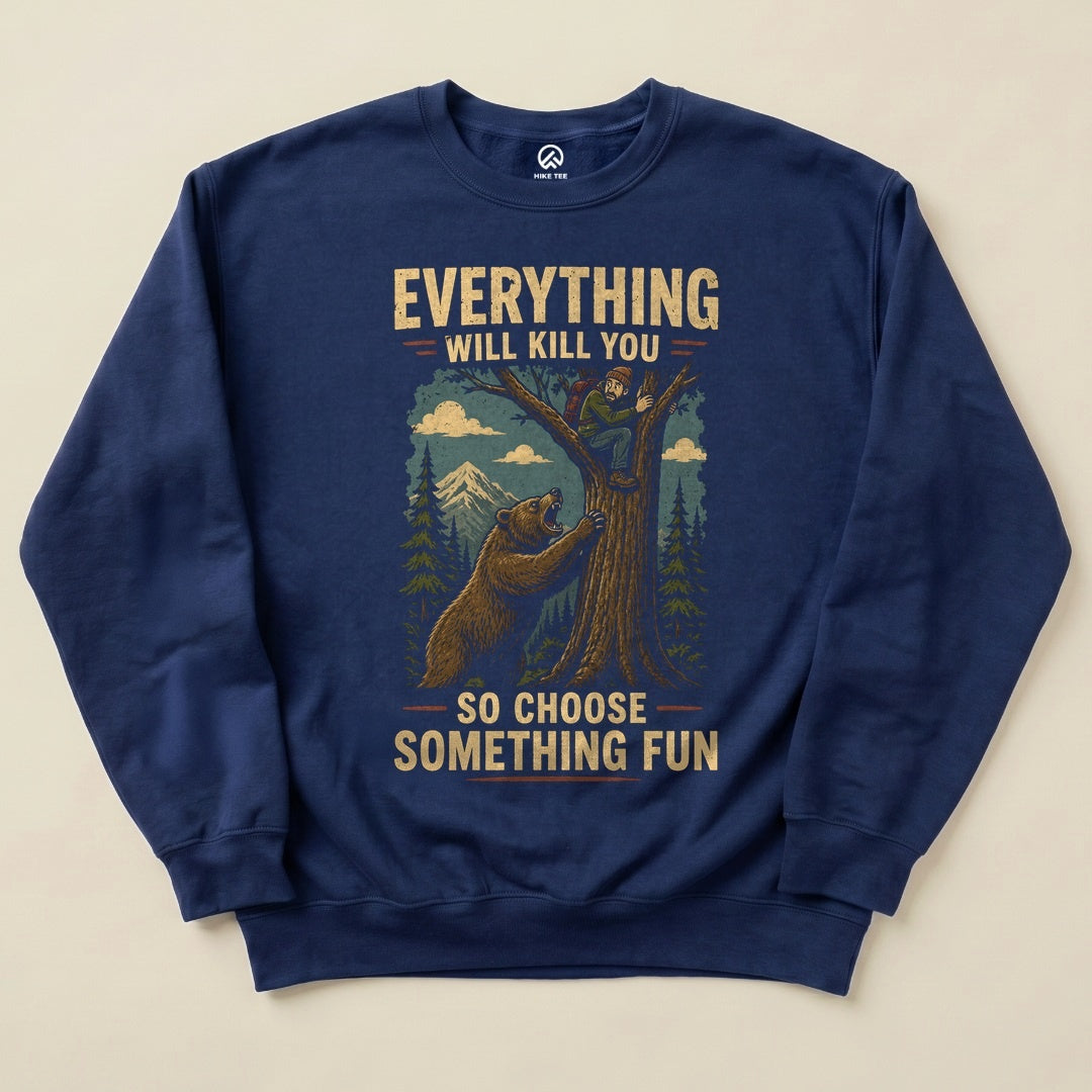 A navy blue "Everything Will Kill You Sweatshirt" features a bear climbing a tree while a man clings to the trunk, reminding to "choose something fun.