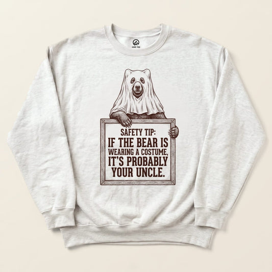 Ash Bear Safety Tip Sweatshirt with a bear in a ghost costume holding a safety tip sign graphic