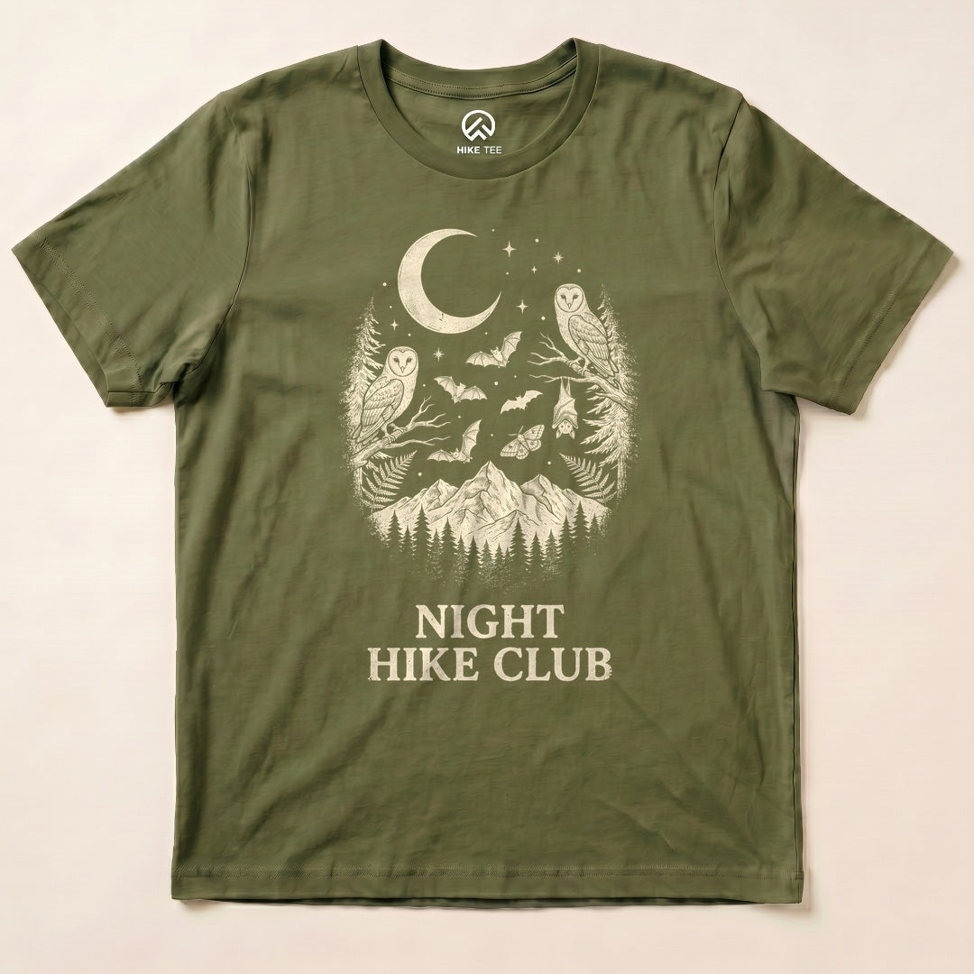 Military Green Night Hike Club Shirt with a crescent moon, owls, bats and mountains graphic