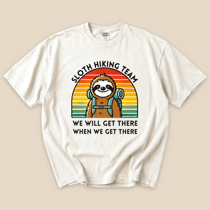 Ivory Sloth Hiking Team T-Shirt with a backpacking sloth and retro sunset graphic