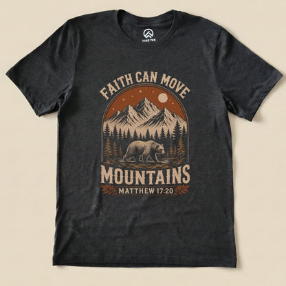 Graphic t-shirt featuring a bear, mountains, and the phrase "Faith Can Move Mountains" along with "Matthew 17:20".