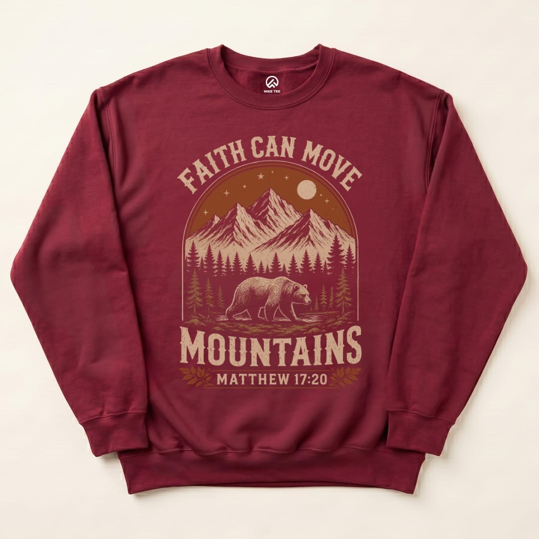 A maroon "Faith Can Move Mountains Sweatshirt" features a graphic of a bear in front of mountains and trees, with the slogan above.