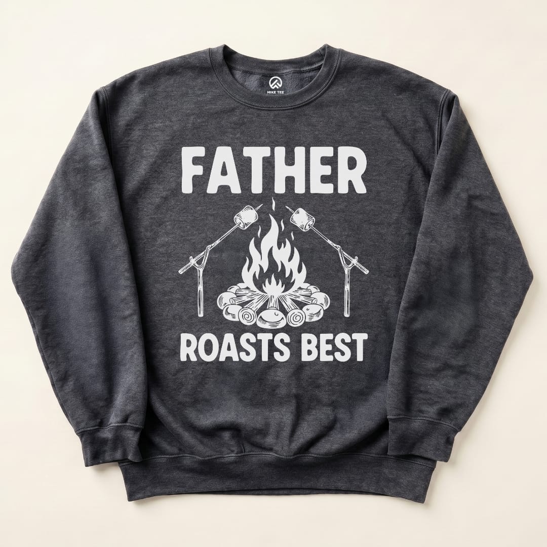 A dark sweatshirt featuring the slogan "FATHER ROASTS BEST" with graphic imagery of a campfire and roasting marshmallows.