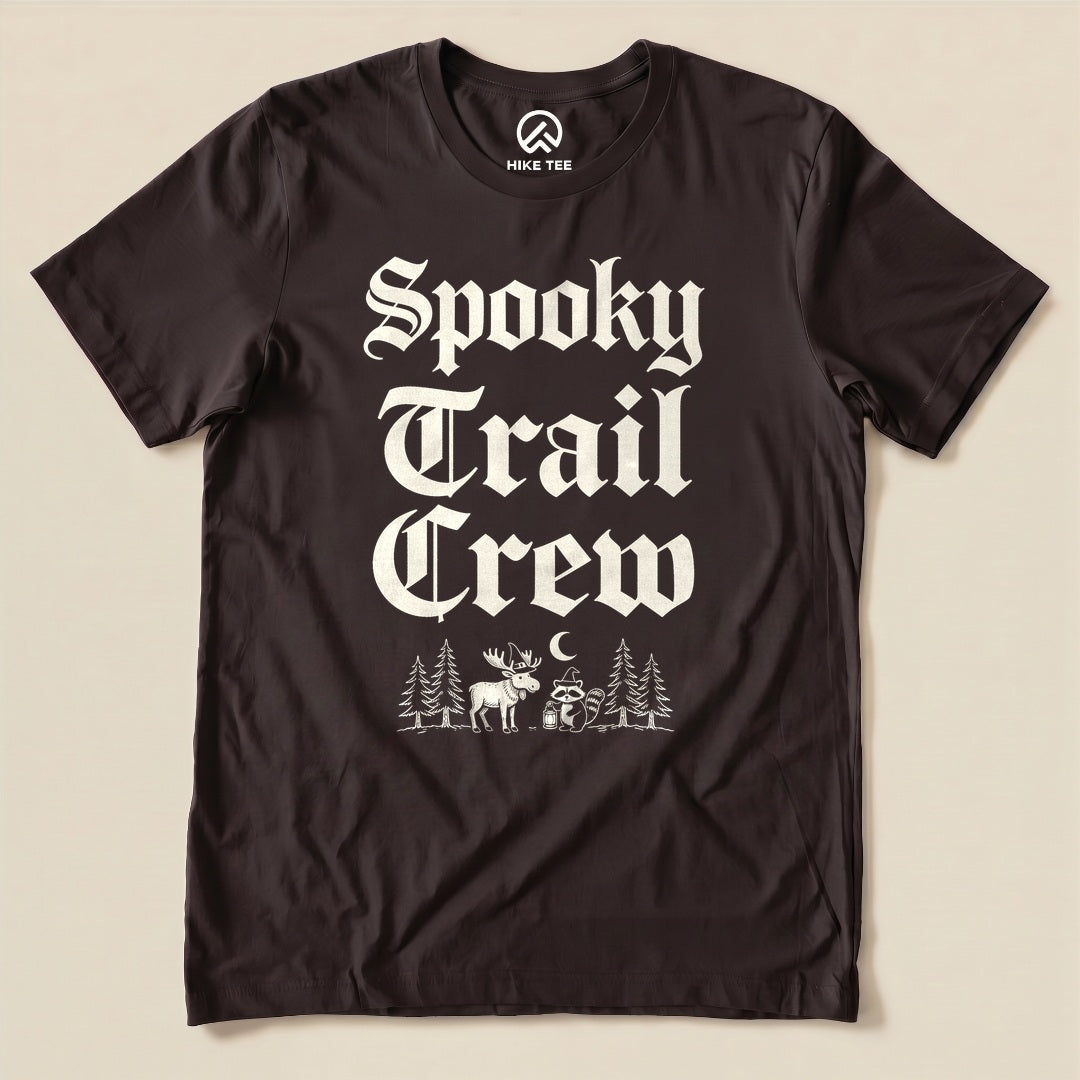 Brown Spooky Trail Crew Shirt with a gothic lettering design with a moose, raccoon and pine trees graphic