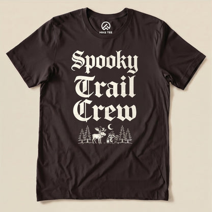 Brown Spooky Trail Crew Shirt with a gothic lettering design with a moose, raccoon and pine trees graphic
