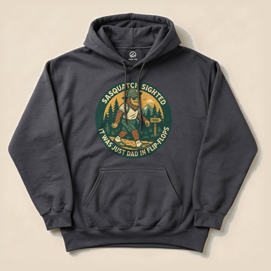 The "Sasquatch Sighted Hoodie" features a graphic of a humorous Sasquatch wearing flip-flops, surrounded by trees and mountains.