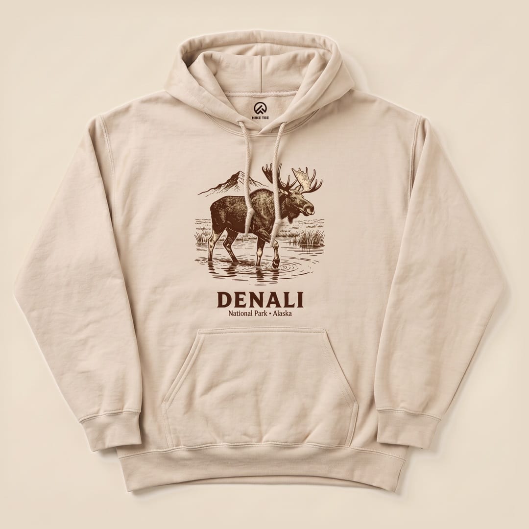 Sand Denali National Park Moose Hoodie with a moose walking through a Denali river graphic