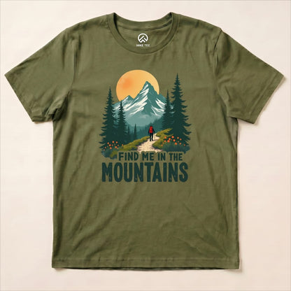The olive green graphic t-shirt displays a hiker walking on a trail with the text "FIND ME IN THE MOUNTAINS" beneath a mountain scene.