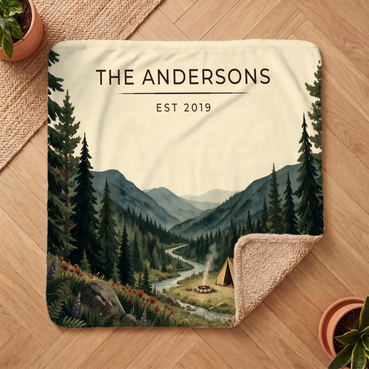 Cozy Forest Campsite Sherpa Blanket featuring a serene landscape with a tent, mountains, and a river scene.