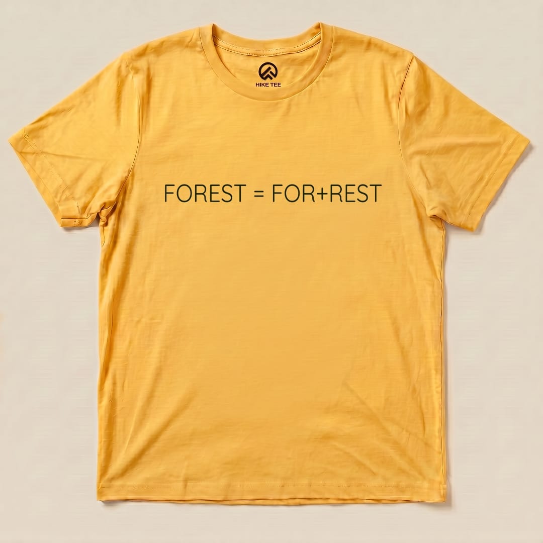 A flat graphic t-shirt in mustard yellow featuring the phrase "FOREST = FOR+REST" printed in green text.