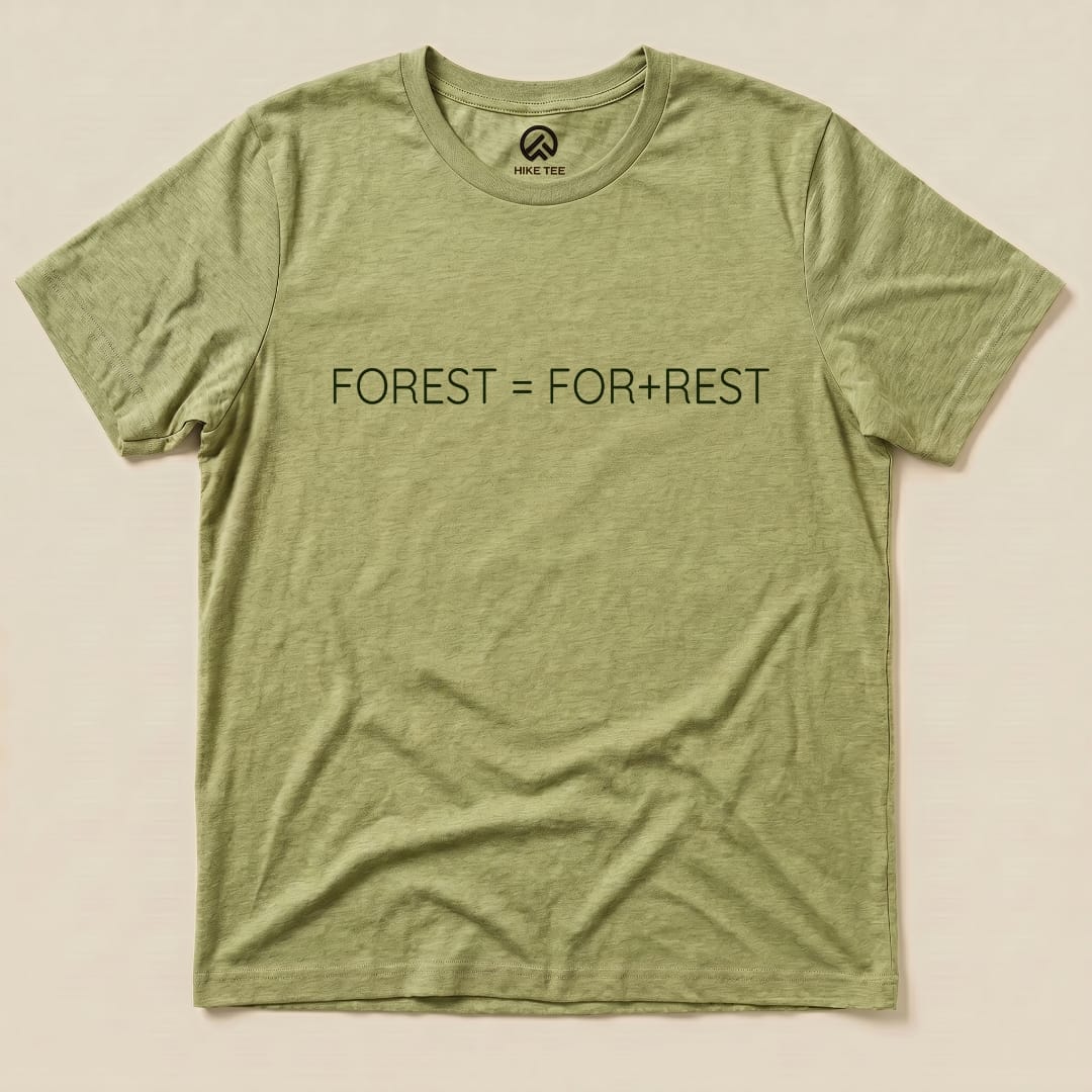 A flat graphic t-shirt in light green featuring the printed text "FOREST = FOR+REST.