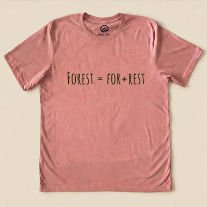 A light pink graphic t-shirt featuring the slogan "Forest = For + Rest" prominently displayed in dark text.