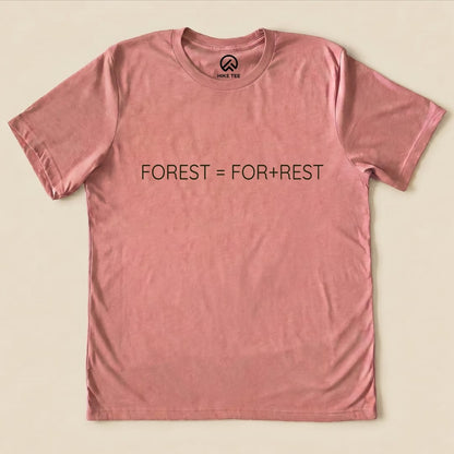 A pink graphic t-shirt featuring the printed design "FOREST = FOR+REST" in bold black text, highlighting a humorous outdoor theme.