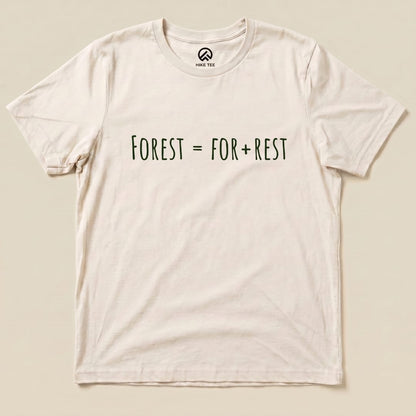 A flat lay of the Forest For Rest Shirt featuring the playful text "FOREST = FOR + REST" in green on a light background.