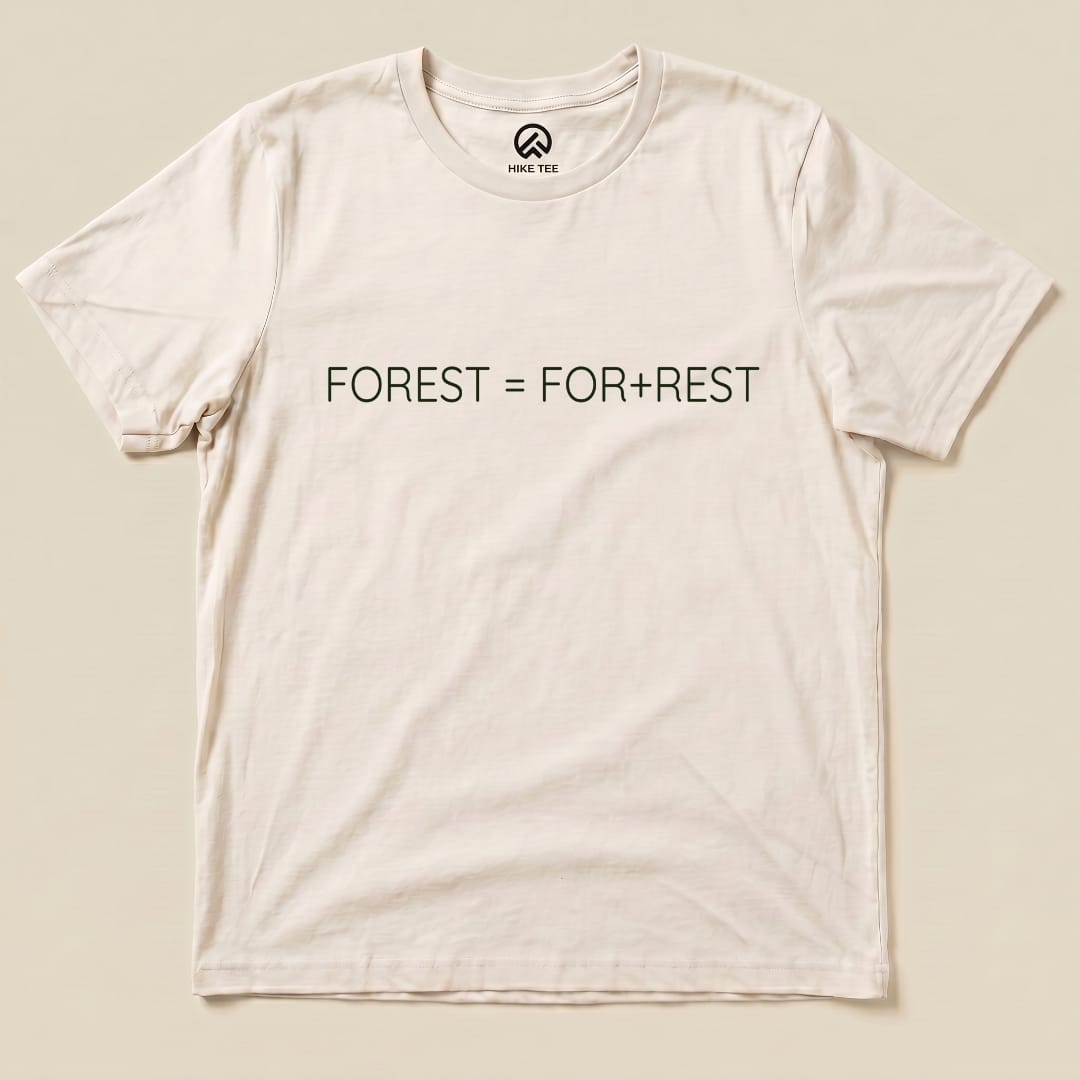 A flat view of a graphic t-shirt featuring the text "FOREST = FOR+REST" in green, showcasing a clever outdoor-themed design.