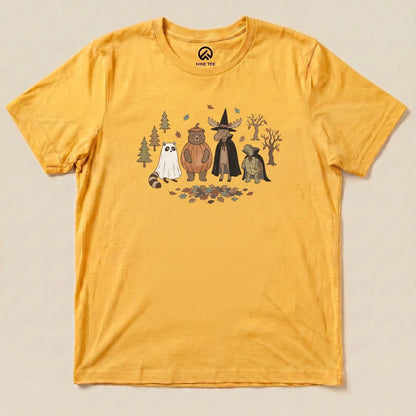 A graphic t-shirt featuring cartoon animals, including a bear and a raccoon, dressed for a "Forest Friends Costume Party Shirt.