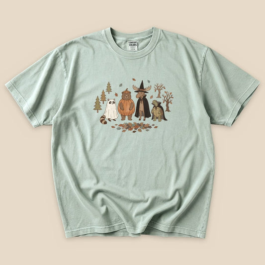 The graphic t-shirt features a "Forest Friends Costume Party T-Shirt" design with cartoon animals dressed for a party among trees and leaves.