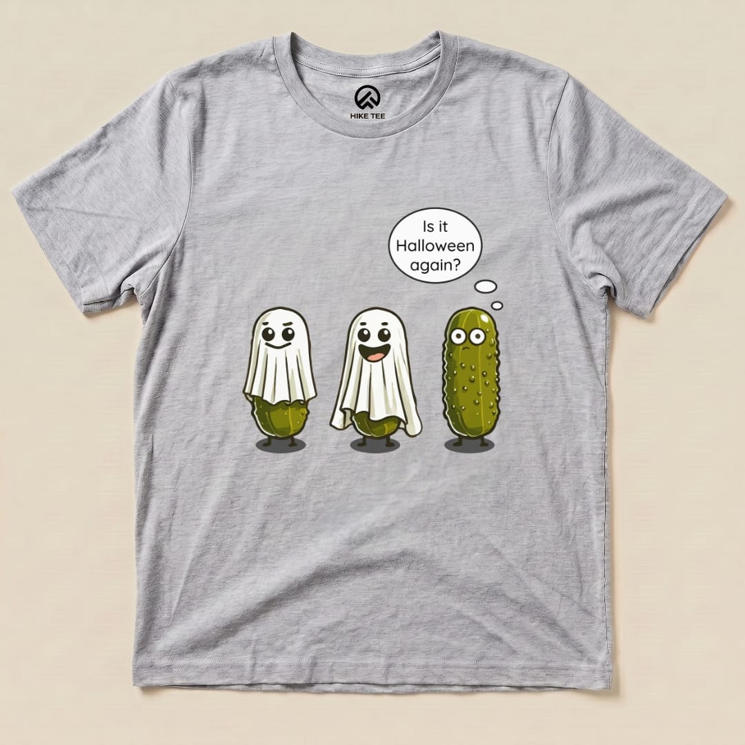 A graphic t-shirt featuring three pickle characters dressed as ghosts with the text "Is it Halloween again?" on a gray background, labeled as "Funny Pickle Ghost Shirt.