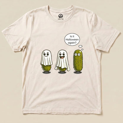 A graphic t-shirt featuring three cute pickles dressed as ghosts with the caption, "Is it Halloween again?", known as the Funny Pickle Ghost Shirt.