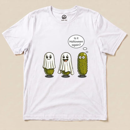 A white graphic t-shirt features three cute ghostly pickles, with the text, "Is it Halloween again?" on the Funny Pickle Ghost Shirt.