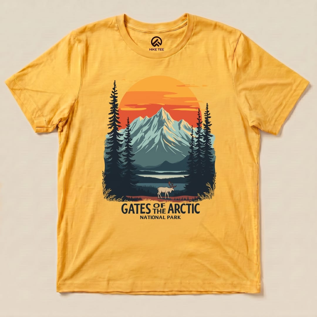 The yellow graphic t-shirt features a scenic design with mountains, pine trees, and a grazing caribou, labeled "Gates of the Arctic National Park.