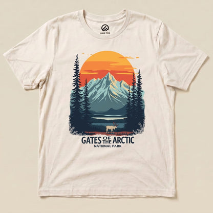 A graphic t-shirt featuring a scenic design of mountains, trees, and a caribou, labeled "Gates of the Arctic National Park Shirt.