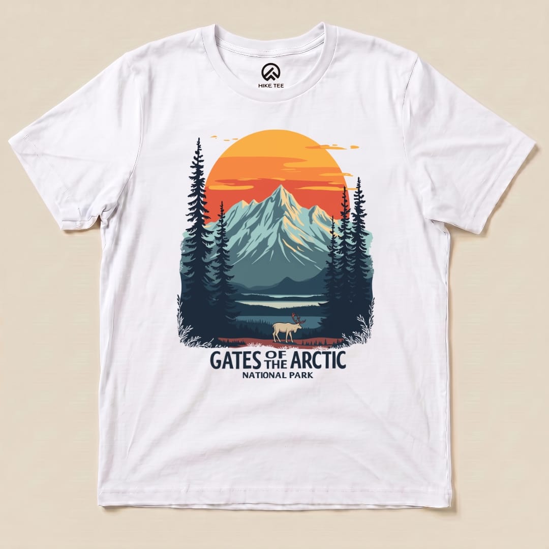 A graphic t-shirt featuring the "Gates of the Arctic National Park Shirt" design with mountains, trees, and a sunset.