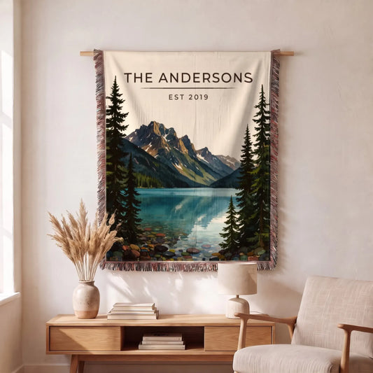 Graphic t-shirt featuring a scenic design of Glacier Lake McDonald, adorned with tree silhouettes and mountains.
