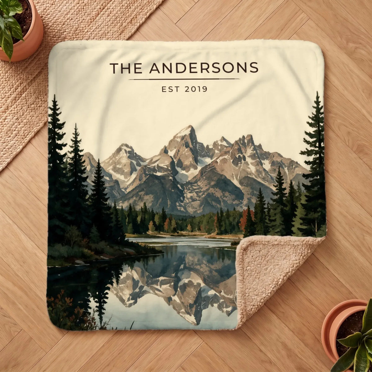 Personalized Grand Teton Schwabacher Landing Sherpa Blanket on a wooden floor with the cozy sherpa back showing