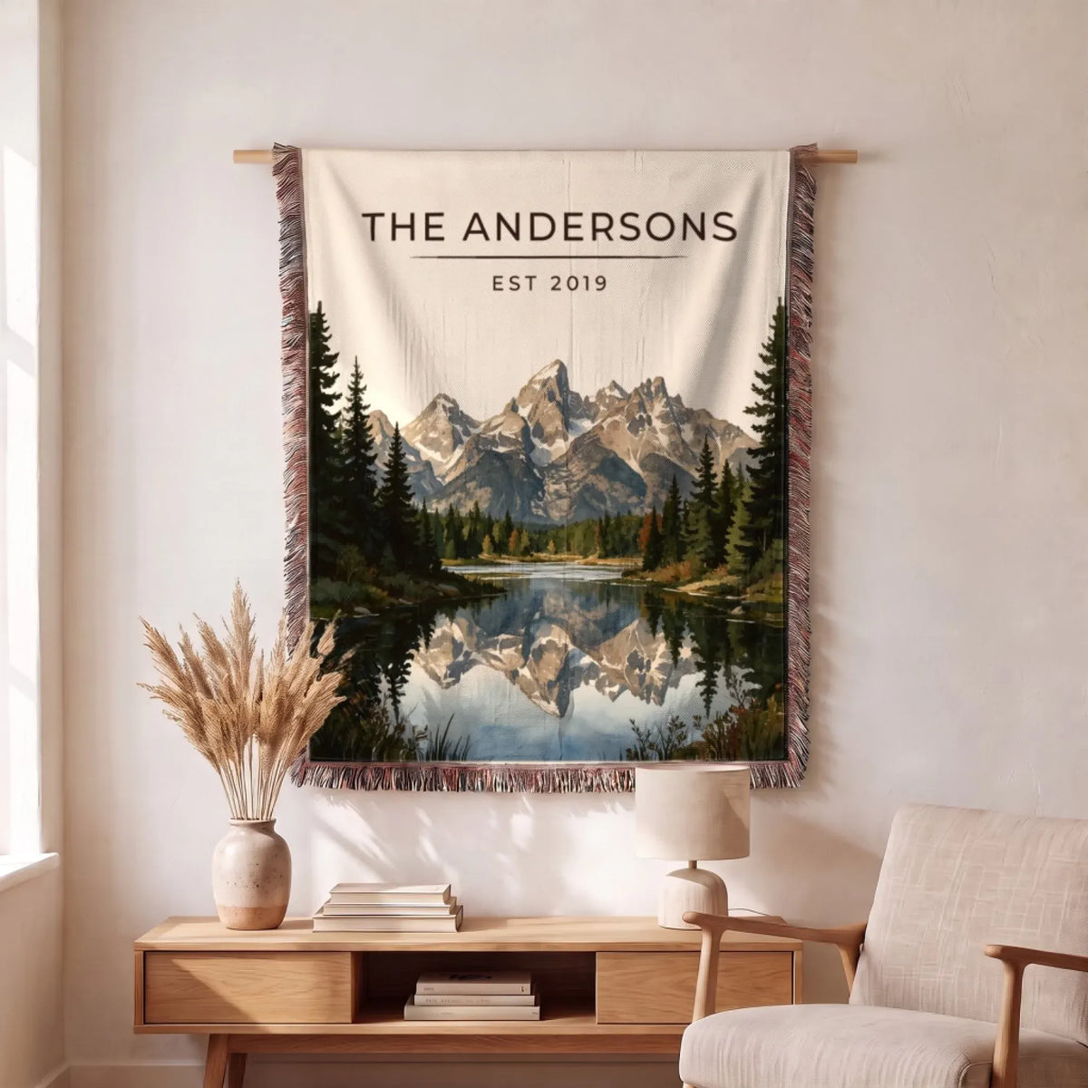 Personalized Grand Teton Schwabacher Landing Woven Blanket hanging on a wall, family name woven in