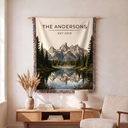 Personalized Grand Teton Schwabacher Landing Woven Blanket hanging on a wall, family name woven in