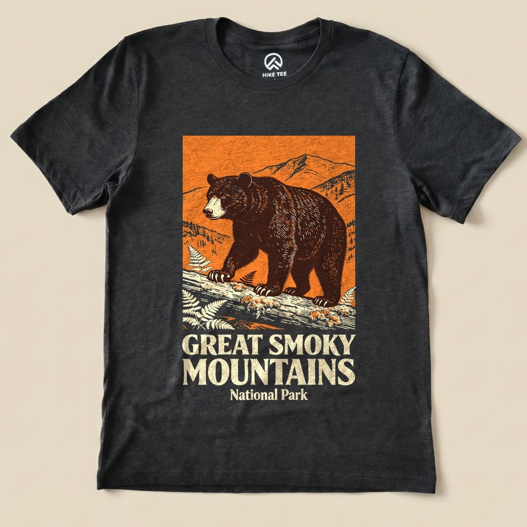Graphic t-shirt featuring a bear walking on a log with the text "Great Smoky Mountains National Park" in bold letters.