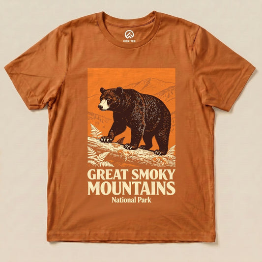 A graphic t-shirt in burnt orange featuring a bear and the text "Great Smoky Mountains National Park" below it.