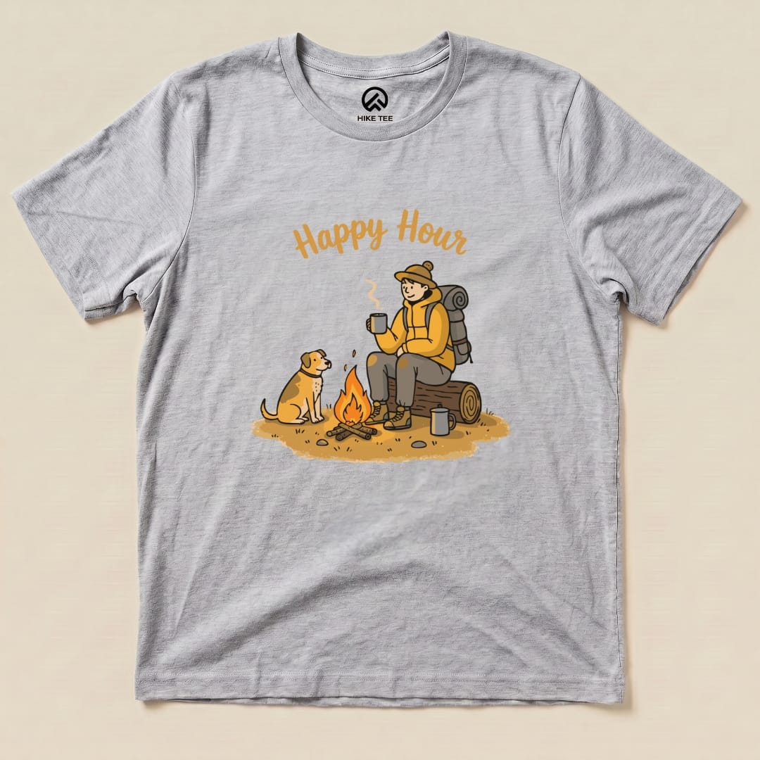 The graphic t-shirt features a cozy camping scene with the phrase "Happy Hour" above an illustration of a person and a dog by a campfire.