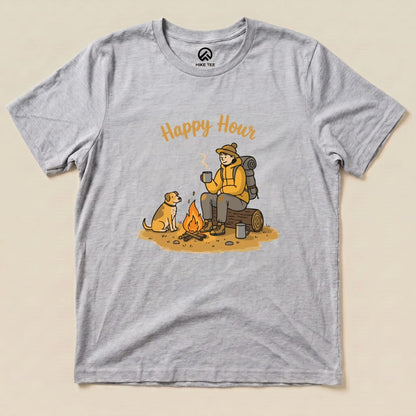 The graphic t-shirt features a cozy camping scene with the phrase "Happy Hour" above an illustration of a person and a dog by a campfire.