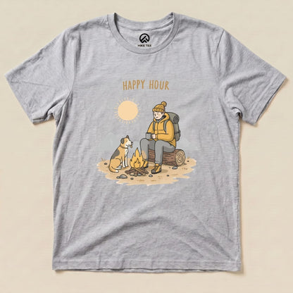 Graphic t-shirt featuring a camper sitting by a campfire with a dog, adorned with the words "HAPPY HOUR" and a sun graphic.
