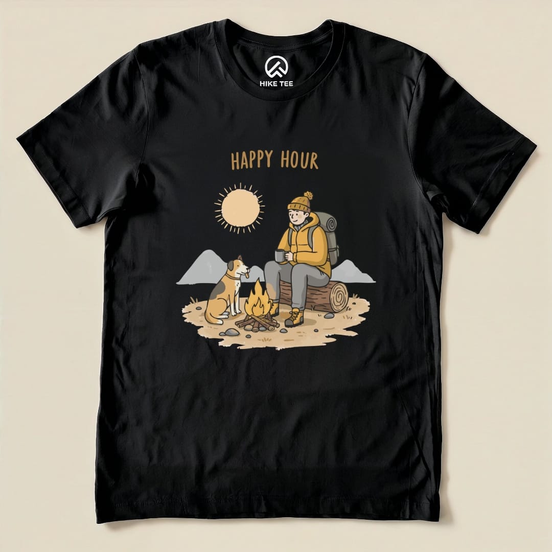 A graphic t-shirt featuring a cozy camping scene with a smiling man, a dog, a campfire, and the text "HAPPY HOUR.