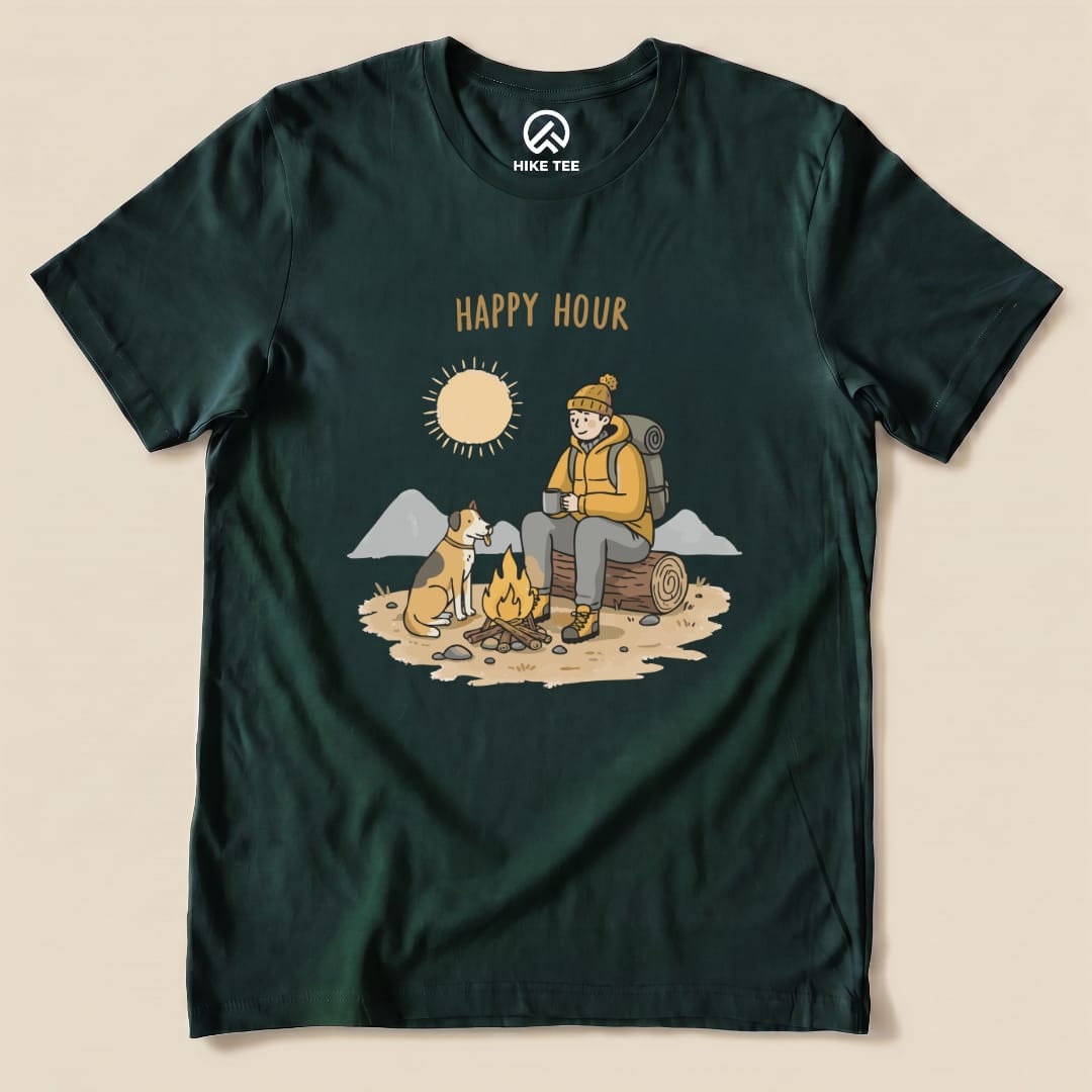 A dark green graphic t-shirt features an illustration of a camper with a dog by a campfire, titled "HAPPY HOUR.