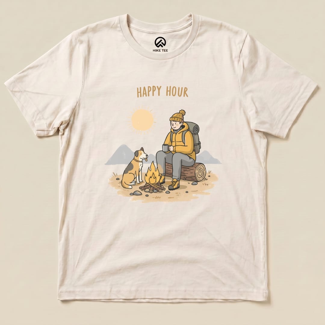 A graphic t-shirt featuring an illustration of a hiker enjoying a drink by a campfire with the phrase "HAPPY HOUR" above.
