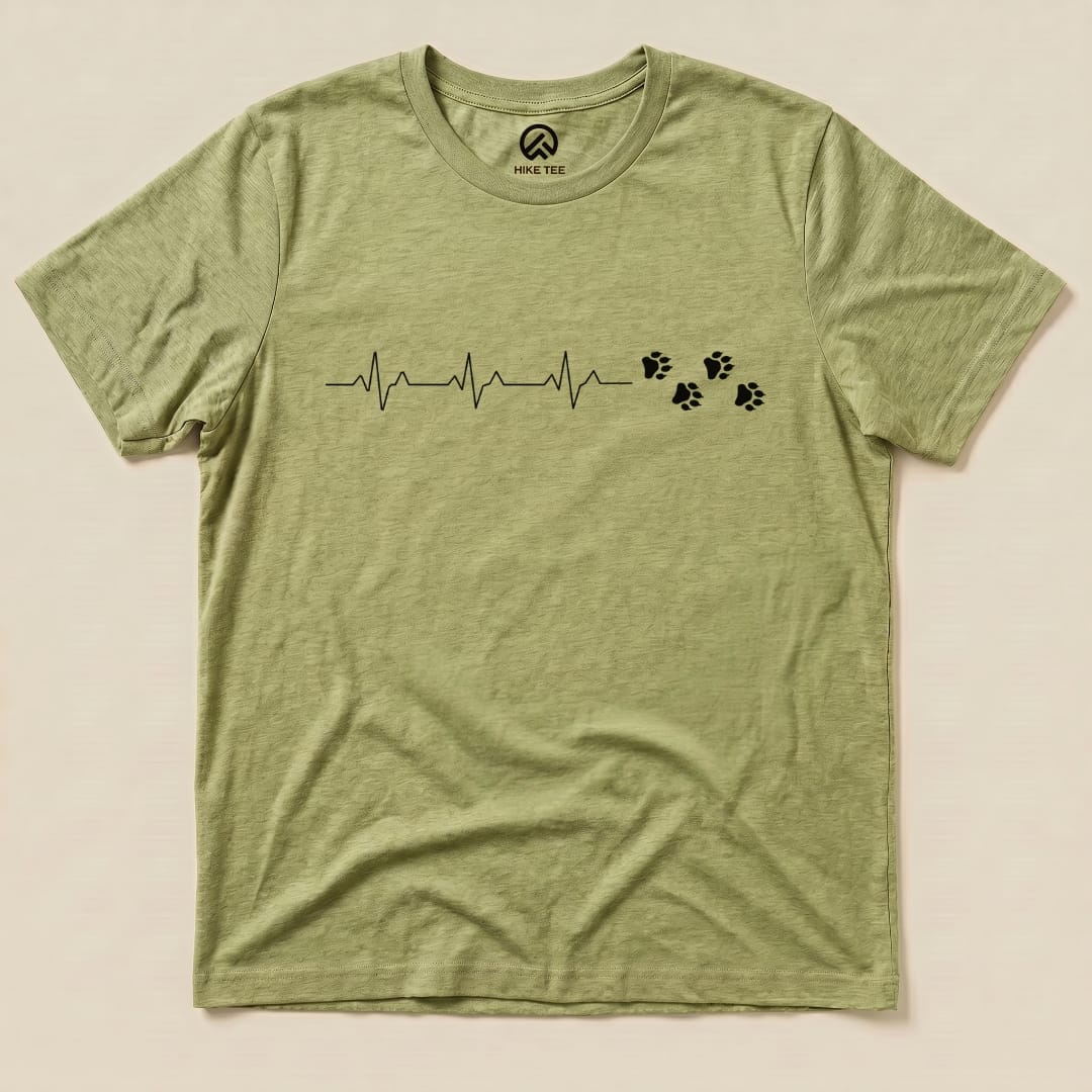 A flat view of the Heart Beat Faws Shirt, featuring a heartbeat graphic with paw prints, showcasing its humorous outdoor theme.