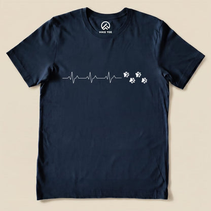 The Heart Beat Faws Shirt features a heartbeat line design accompanied by playful paw prints, showcasing a fun, outdoor-themed graphic t-shirt.