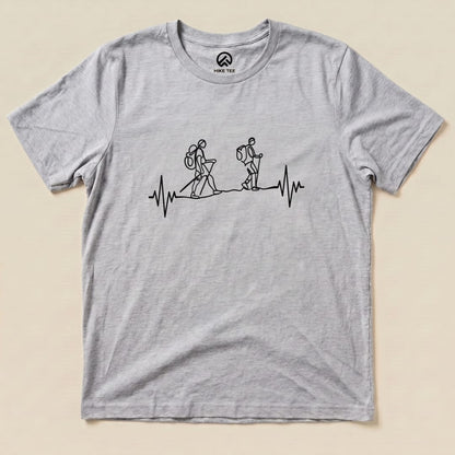 A gray graphic t-shirt features a design of two hikers walking above a heartbeat line, labeled as a "Heart Rate Hiking Shirt.