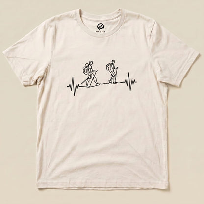 A graphic t-shirt featuring line-art hikers and a heartbeat symbol, representing the "Heart Rate Hiking Shirt" design.