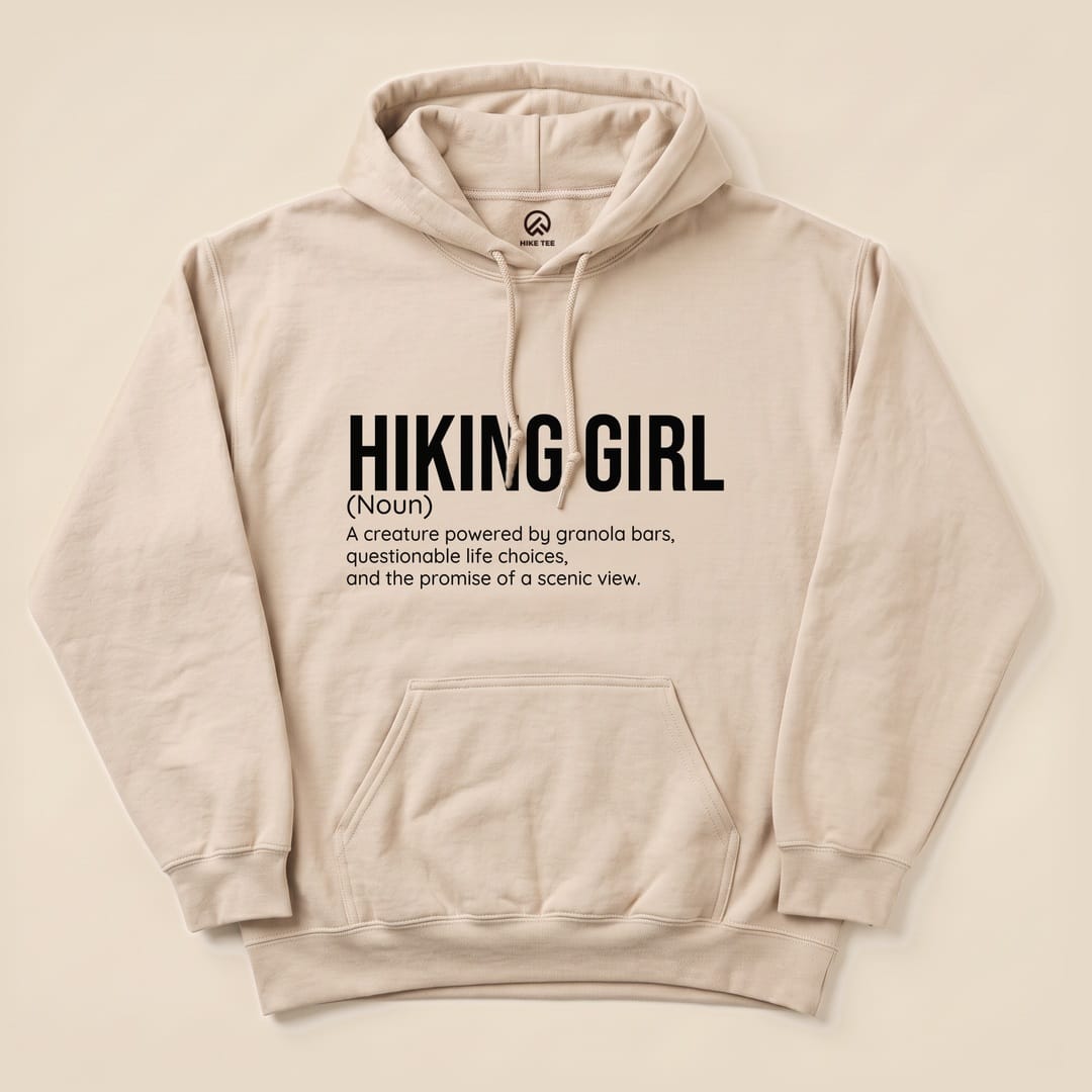 The "Hiking Girl Definition Hoodie" features a humorous definition of a hiking girl, printed in bold black text on a light beige background.
